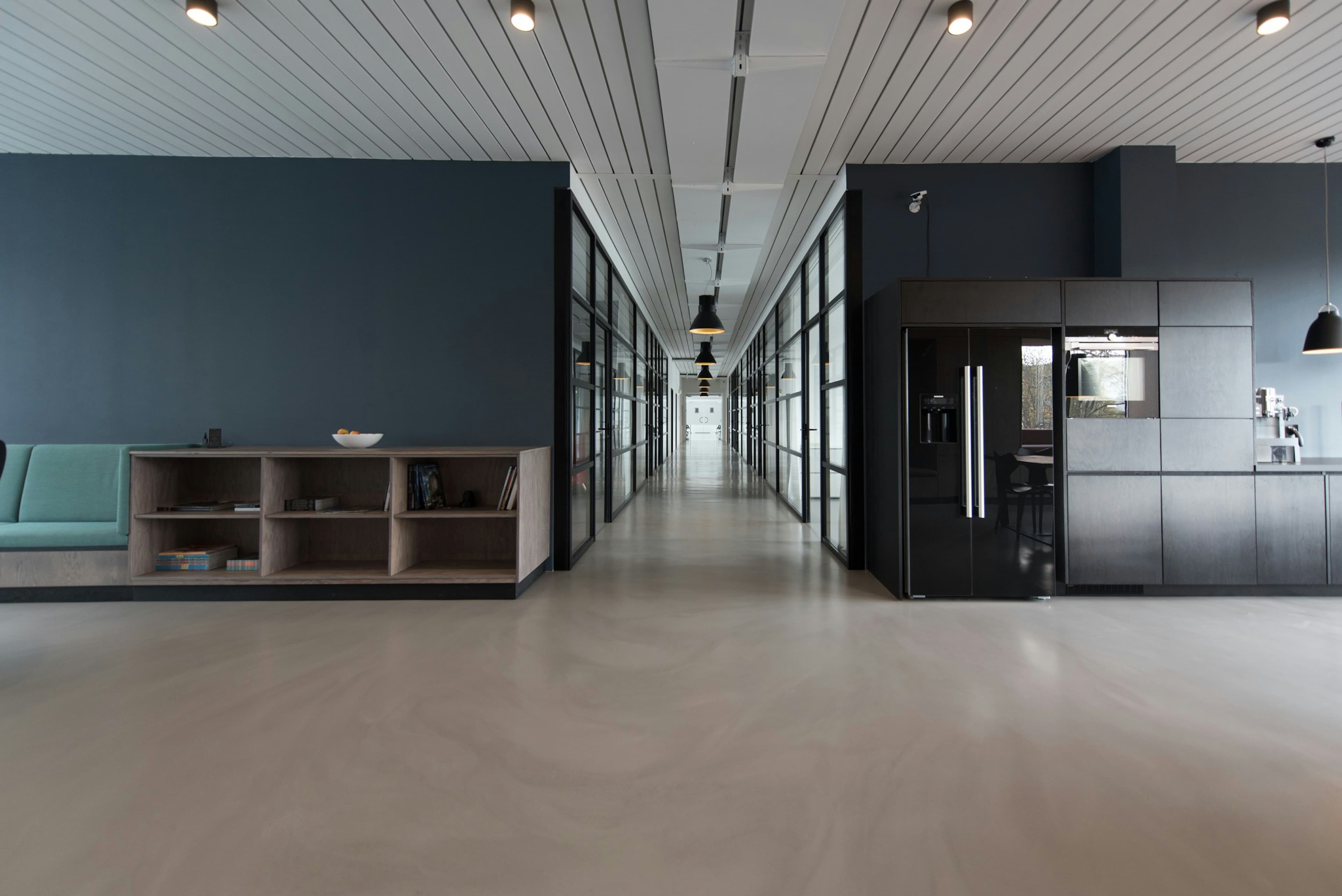 Sunlit modern office interior with glass partitions