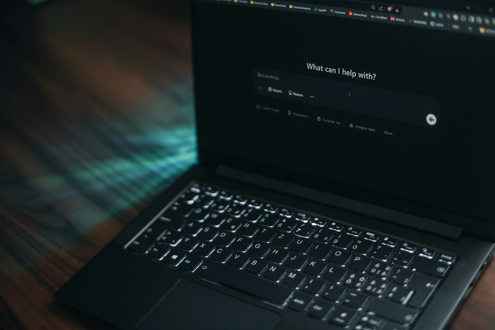 Laptop screen showing an AI assistant asking how it can help